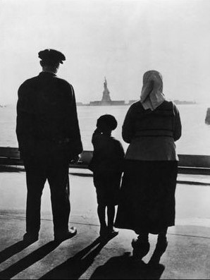 Immigrant Family looking at Statue of Liberty