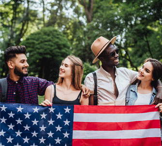 Young family celebrating with American flag – Immigration Law Las Vegas